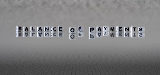 balance of payments word or concept represented by black and white letter cubes on a grey horizon background stretching to infinity