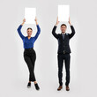 © Prostock-studio - Happy people holding blank white advertising billboard at studio, collage
