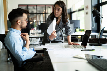 Wall Mural - Colleagues arguing in office. Angry businesswoman yelling at her collegue..