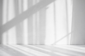 Abstract white background. Shadows on a white table and a white wall.