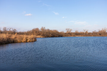 Wall Mural - Landscape of a Water Filled Quarry in Suburban Lemont Illinois during Autumn