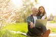 © Angelov - Smiling child hugging her happy grandfather - outdoor in nature.