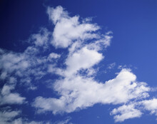 Cumulus Clouds In A Blue Sky