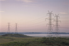 Electricity Pylons In A Field