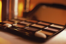 Close-up Of Eye Shadow Compact And Applicator