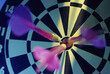 © SuperStock - Close-up of three darts in the bull's-eye of a dartboard