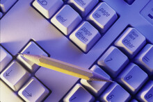 High Angle View Of A Pencil On A Computer Keyboard