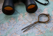 Compass And Binoculars On A World Map, South Georgia Island, South Sandwich Islands