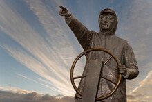 Low Angle View Of A Fisherman's Statue, Rotary Waterfront Park, Prince Rupert, British Columbia, Canada