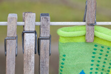 Close Up Of Wooden Clothespins On Clothes Line