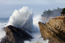 USA, Oregon, Shore Acres State Park, Ocean Waves Crashing Against Cliff
