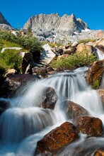 Stream Flowing Through Rocks In A Lake, Ediza Lake, Mt Ritter, Ansel Adams Wilderness, Inyo National Forest, California, USA