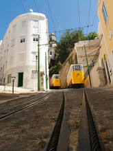 Electric Tram Passing Through Buildings, Lisbon, Portugal
