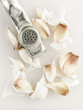 © SuperStock - Close up of cloves of garlic and garlic crusher on white board
