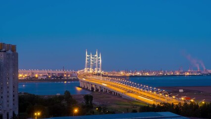 Sticker - St Petersburg, Russia. Huge modern highway bridge at Vasilievsky Island in Saint Petersburg, Russia. Time-lapse at sunset with clear sky in summer