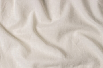 White crumpled linen fabric texture background. Natural linen organic eco textiles canvas background. Top view