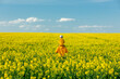© Masson - Father with a son in rapeseed field in spring time