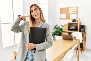 Sticker - Blonde business woman at the office smiling cheerful showing and pointing with fingers teeth and mouth. dental health concept.