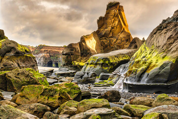 Wall Mural - the dramatic rugged rock formations and caves on the coastline at Tongaporutu in rural Taranaki