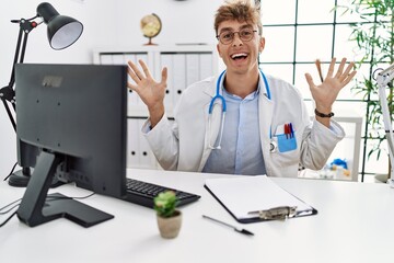 Sticker - Young caucasian doctor man working at the clinic celebrating crazy and amazed for success with arms raised and open eyes screaming excited. winner concept