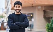 Young Arab Man Smiling Confident Standing With Arms Crossed Gesture At Street