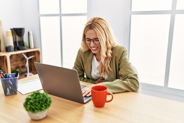 Poster - Beautiful blonde woman working at the office with laptop with hand on stomach because nausea, painful disease feeling unwell. ache concept.