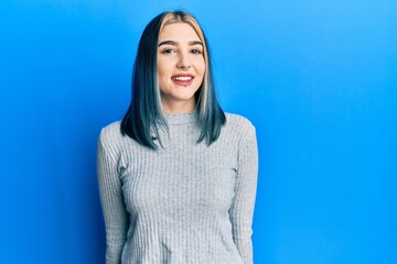 Wall Mural - Young modern girl wearing casual sweater with a happy and cool smile on face. lucky person.