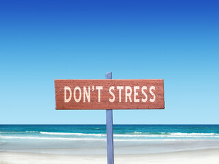 Don't Stress sign for relaxation and mindfulness on nature background.