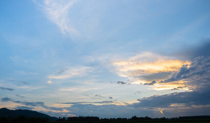 Wall Mural - colorful sunset and sunrise with clouds. blue and orange color of nature. many white clouds in the b