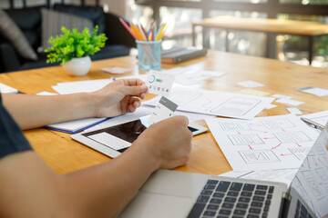 Wall Mural - graphic designers work together with ux ui designer planning application template layout framework f