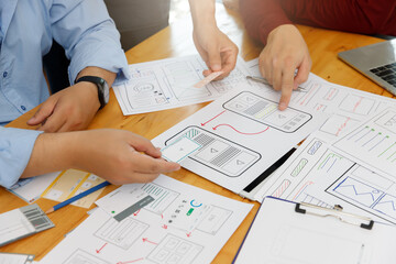 Wall Mural - graphic designers work together with ux ui designer planning application template layout framework f