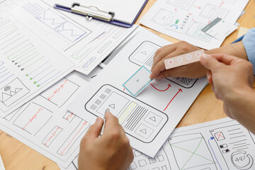 Wall Mural - graphic designers work together with ux ui designer planning application template layout framework f