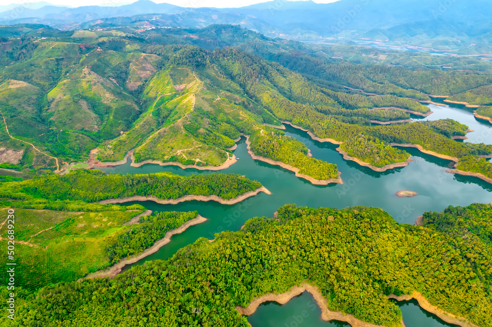 Landscape Ta Dung lake seen from above in the morning with small islands  many green trees