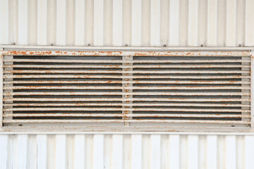 Wall Mural - Old, rusty, with peeling paint, ventilation window grille on a sheathing wall, background image, texture