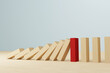 Leinwandbild Motiv Risk management concept. Wooden block stopping domino effect for business. 3d render illustration