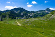 © Oleksandr Baranov - Montenegro. Durmitor National Park. Saddle Pass. Alpine meadows. Mountain landscape. Popular tourist spot
