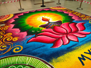 SELANGOR, MALAYSIA -OCTOBER 29, 2021: Attractive Deepavali Kolam design. Built using colored rice by experts and its design is based on elements in Indian society. Colorful and beautiful. 