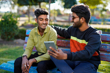 young indian people using technology