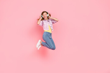 Sticker - Photo of funny carefree inspired lady jump listen favorite song wear earphones jacket isolated pink color background