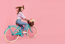 Photo Of Funky Courier Lady Person Drive Bike Wind Blow Hair Wear Casual Outfit Isolated Pink Color Background