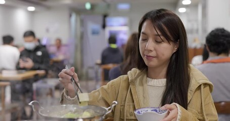 Poster - Woman enjoy her hot pot at restaurant