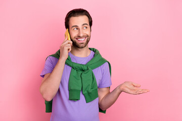 Sticker - Photo of impressed young beard man talk telephone wear purple t-shirt green sweatshirt isolated on pink color background