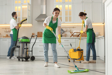 Wall Mural - Team of professional janitors working in kitchen