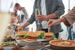 © New Africa - People near buffet table with food indoors, closeup. Brunch setting