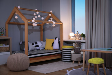 Wall Mural - Stylish child room interior with comfortable house bed and toys