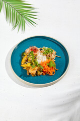 Canvas Print - Asian appetizers: spicy carrot, pickled cucumber, soy bean and rice. Assorted asian appetizers in ceramic dish on white background. Asian food in summer menu.