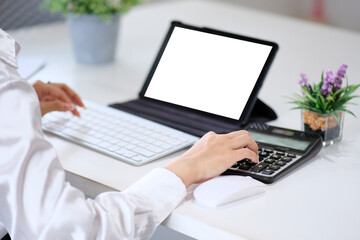 Canvas Print - Woman accountant using calculator and laptop computer in office, businessman working at home, finance and accounting concept.