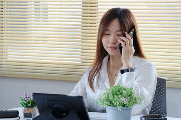 Sticker - Woman is utilizing a laptop computer. Using a smartphone, online live chat chatting on an application communication website and social network