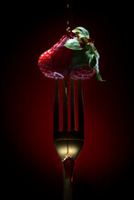 Ripe Red Strawberry With Green Leaf On Fork