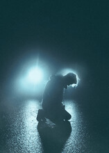 Man So Sad Stand On Ground Alone While Going Rain In The Dark Night With Lighting Lamp Of Car